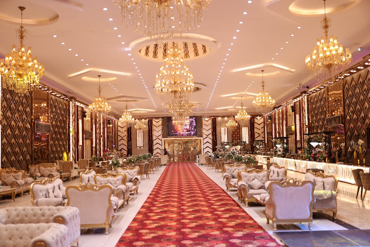 Home Elegant wedding hall with luxurious chandeliers and classic decor, perfect for special events.